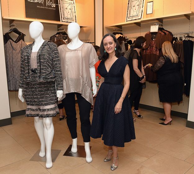 Isabel Toledo standing next to her plus size designs for Lane Byrant in 2014
